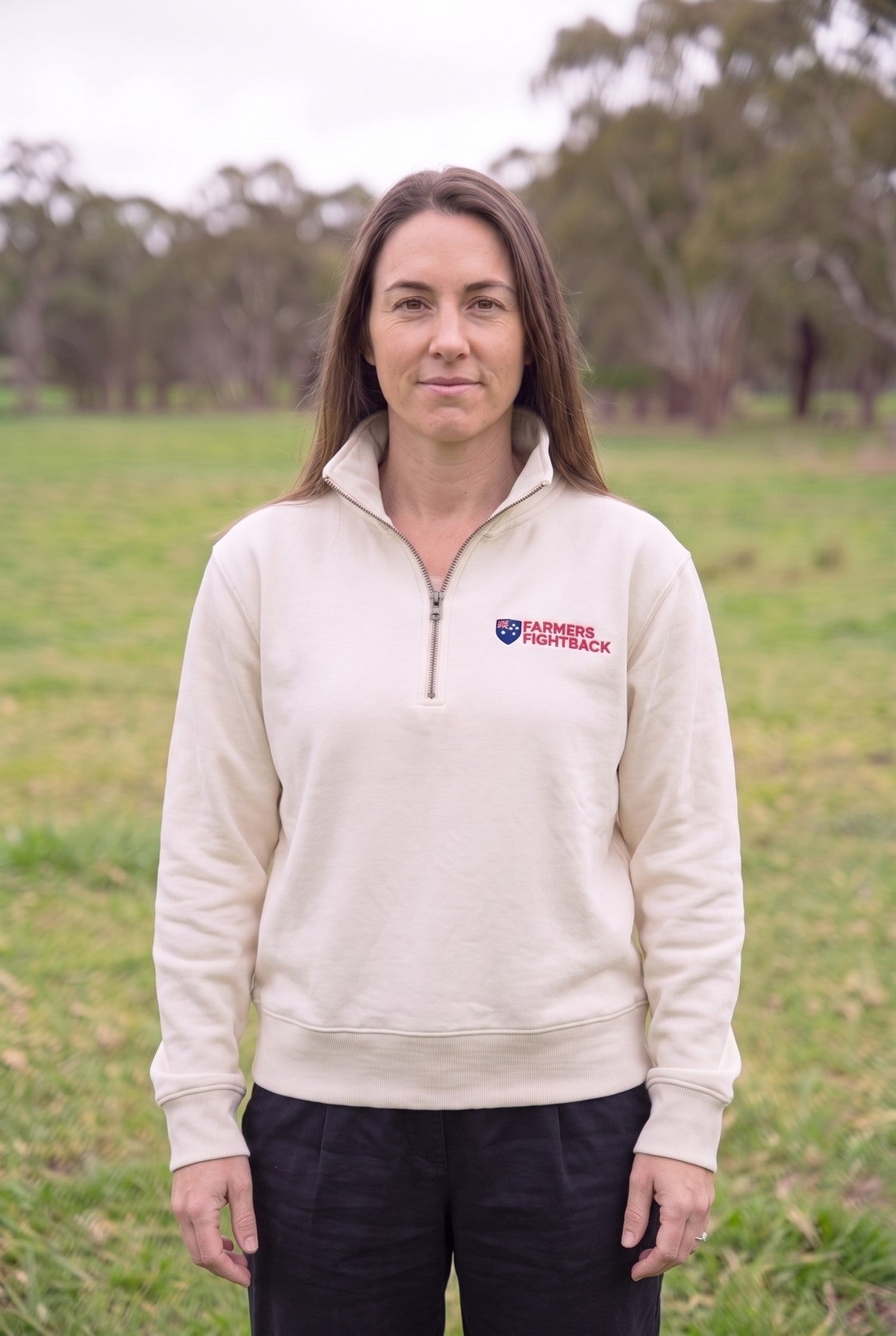 Ecru quarter zip, womens fit, worn in an Australian paddock