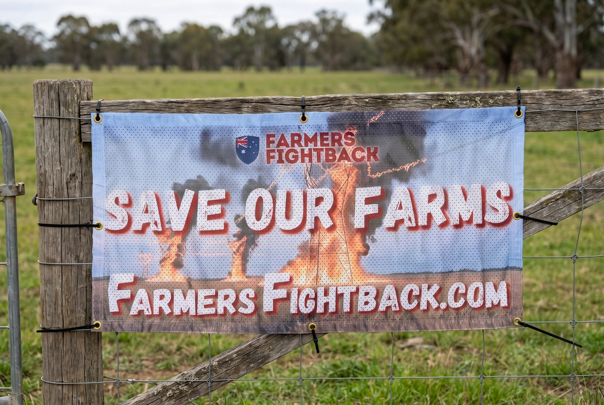 Farmers Fightback Save Our Farms banner on a timber strainer post