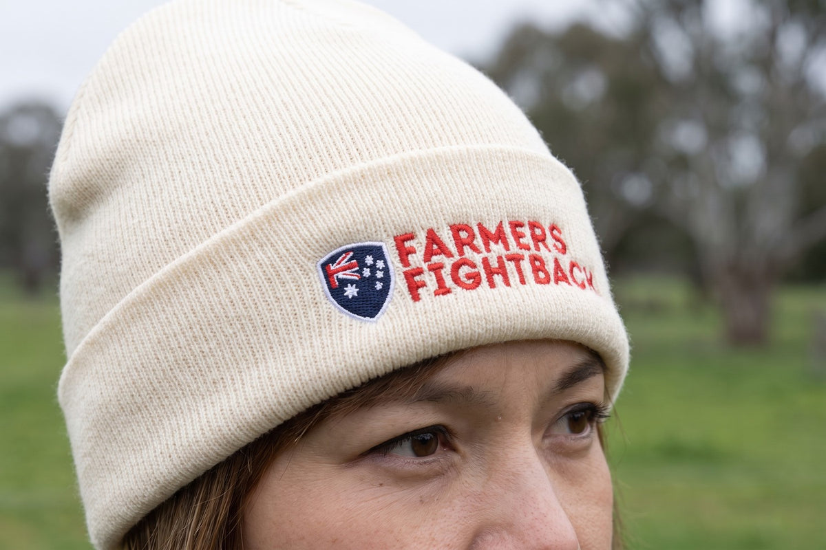 Cream beanie worn