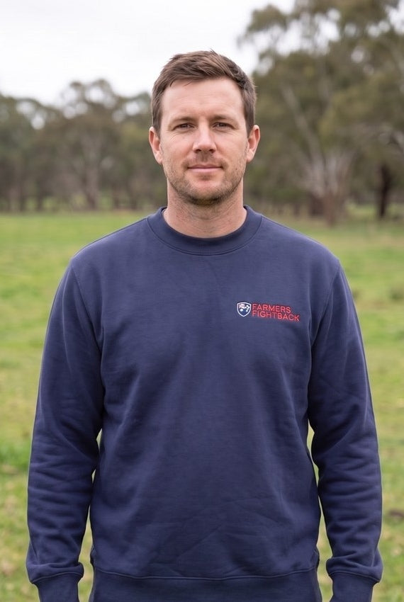 Midnight blue crew jumper, mens fit, worn in an Australian paddock